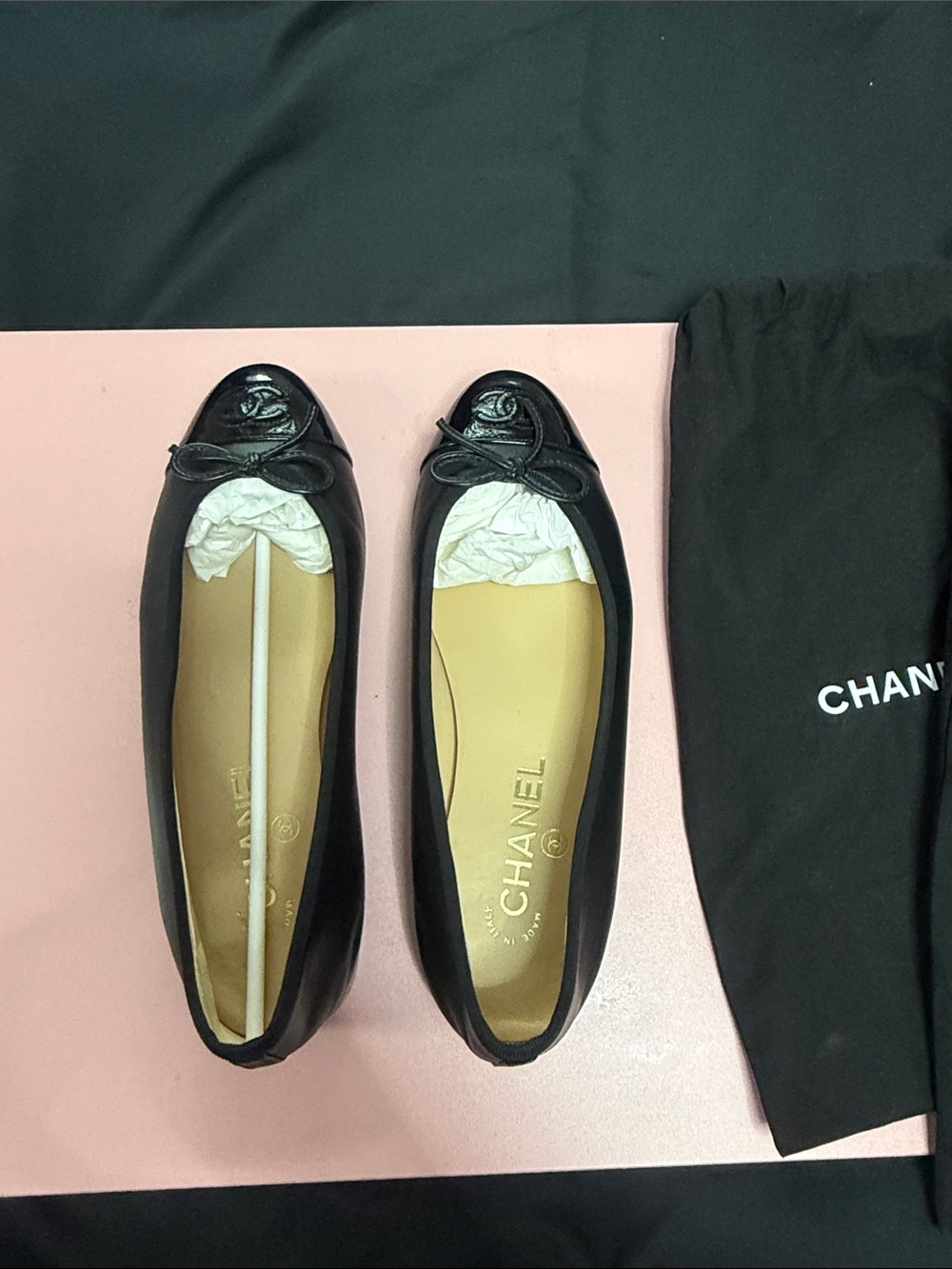 CHANEL Black Leather Ballet Flats with CC Cap Toe and Bow